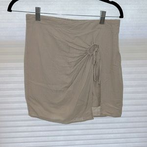Khaki linen, small skirt with shorts underneath